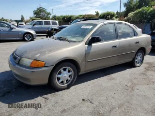 1998 Mazda Protege DX with VIN JM1BC1414W0203670, listed as a Copart auction lot 62966544 with 249,405 mi miles and Salvage Title. Bid and sale history available at DreamBid. Image 1.