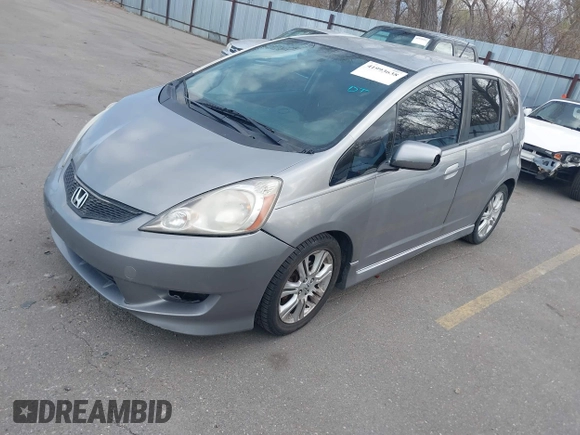 2009 Honda Fit Sport with VIN JHMGE884X9S045470, listed as a IAAI auction lot 41993638 with 181,198 mi miles. Bid and sale history available at carsss.com. Image 2.