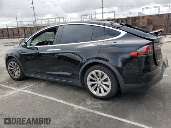 2018 Tesla Model X 75D with VIN 5YJXCBE24JF130216, listed as a Copart auction lot 48894215 with 75,694 mi miles and Salvage Title. Bid and sale history available at carsss.com. Image 2.