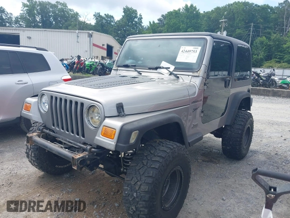 2002 Jeep Wrangler Sport with VIN 1J4FA49S52P717811, listed as a IAAI auction lot 42449753 with 252,258 mi miles and . Bid and sale history available at DreamBid. Image 2.