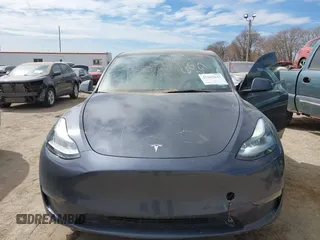 2022 Tesla Model Y Long Range with VIN 7SAYGDEE5NF534259, listed as a IAAI auction lot 41860246 with 24,513 mi miles and . Bid and sale history available at carsss.com. Image 6.