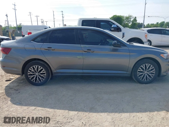 2021 Volkswagen Jetta S z VIN 3VWC57BU0MM093075, wystawiony jako IAAI lot #42067395 z przebiegiem 24 930 mil mil oraz . Historia ofert i sprzedaży dostępna na DreamBid. Obrazek 13.