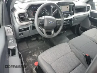 2023 Ford F-150 XL with VIN 1FTMF1C57PKF86630, listed as a Copart auction lot 59172785 with 14,840 mi miles and Salvage title. Bid and sale history available at DreamBid. Image 8.