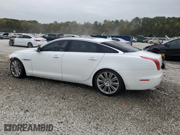 2013 Jaguar XJ with VIN SAJWA2GB8DLV52975, listed as a Copart auction lot 79123644 with 160,473 mi miles and Salvage Title. Bid and sale history available at carsss.com. Image 2.