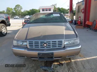 1997 Cadillac Eldorado ESC z VIN 1G6EL12YXVU619553, wystawiony jako IAAI lot #42324158 z przebiegiem 121 311 mil mil oraz . Historia ofert i sprzedaży dostępna na DreamBid. Obrazek 6.