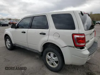 2009 Ford Escape XLS with VIN 1FMCU92749KB31140, listed as a Copart auction lot 53645705 with 213,481 mi miles and Salvage title. Bid and sale history available at DreamBid. Image 2.