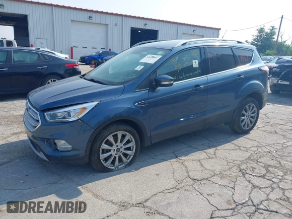 2018 Ford Escape Titanium z VIN 1FMCU0J91JUC00941, wystawiony jako IAAI lot #42679897 z przebiegiem 110 884 mil mil oraz . Historia ofert i sprzedaży dostępna na DreamBid. Obrazek 2.