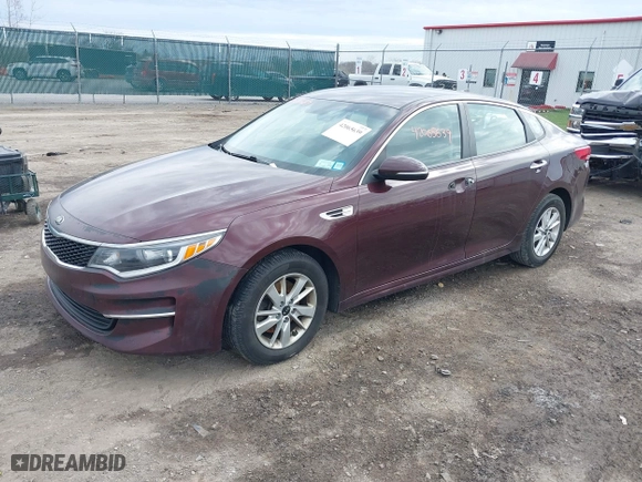 2016 Kia Optima LX with VIN 5XXGT4L36GG108599, listed as a IAAI auction lot 42065639 with 127,387 mi miles. Bid and sale history available at carsss.com. Image 2.