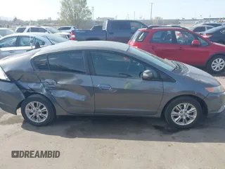 2010 Honda Insight EX with VIN JHMZE2H71AS032532, listed as a IAAI auction lot 41988221 with 333,144 mi miles and . Bid and sale history available at DreamBid. Image 13.