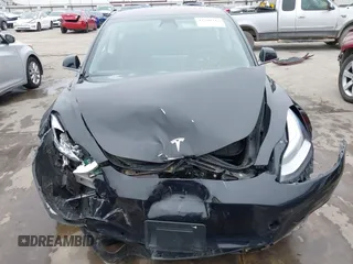 2018 Tesla Model 3 Long Range Battery with VIN 5YJ3E1EB3JF090567, listed as a IAAI auction lot 41568312 with 35,327 mi miles and . Bid and sale history available at DreamBid. Image 13.