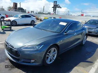 2014 Tesla Model S 60 with VIN 5YJSA1S15EFP29010, listed as a IAAI auction lot 41798180 with 142,754 mi miles and . Bid and sale history available at DreamBid. Image 2.