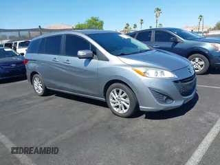 2015 Mazda 5 Sport with VIN JM1CW2BL3F0185779, listed as a IAAI auction lot 42609991 with 158,403 mi miles and . Bid and sale history available at DreamBid. Image 1.
