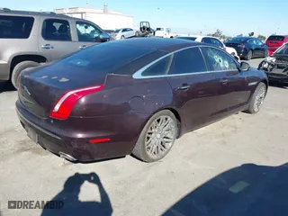 2011 Jaguar XJ with VIN SAJWA1CB8BLV05958, listed as a IAAI auction lot 40799422 with 80,193 mi miles. Bid and sale history available at carsss.com. Image 4.