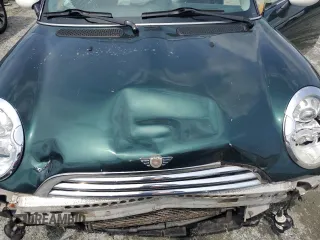 2005 MINI Hardtop z VIN WMWRC33465TC56731, wystawiony jako Copart lot #56404125 z przebiegiem 167 455 mil mil oraz Szkoda całkowita • Salvage title. Historia ofert i sprzedaży dostępna na DreamBid. Obrazek 11.