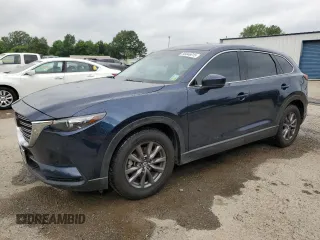 2021 Mazda CX-9 Touring z VIN JM3TCACY2M0512867, wystawiony jako Copart lot #56646615 z przebiegiem 92 566 mil mil oraz Szkoda całkowita • Salvage title. Historia ofert i sprzedaży dostępna na DreamBid. Obrazek 1.