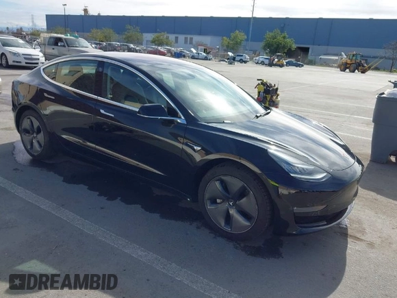 2019 Tesla Model 3 Mid Range with VIN 5YJ3E1EA2KF305834, listed as a IAAI auction lot 41719610 with 126,333 mi miles and . Bid and sale history available at DreamBid. Image 1.