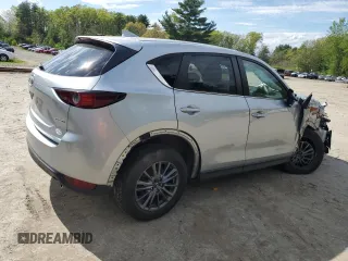 2021 Mazda CX-5 Touring z VIN JM3KFBCM1M0343804, wystawiony jako Copart lot #56194795 z przebiegiem 100 039 mil mil oraz Tytuł czysty. Historia ofert i sprzedaży dostępna na DreamBid. Obrazek 3.