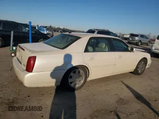 2003 Cadillac DeVille DTS z VIN 1G6KF57963U257494, wystawiony jako Copart lot #84532944 z przebiegiem 104 766 mil mil oraz Szkoda całkowita • Salvage title. Historia ofert i sprzedaży dostępna na DreamBid. Obrazek 3.