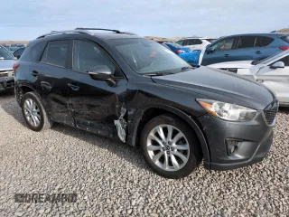2015 Mazda CX-5 Grand Touring with VIN JM3KE4DY3F0495411, listed as a Copart auction lot 50077765 with 136,191 mi miles and Salvage Title. Bid and sale history available at DreamBid. Image 4.