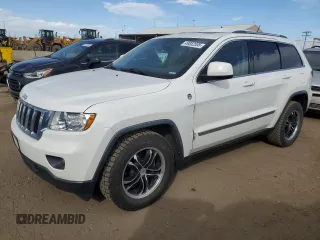 2011 Jeep Grand Cherokee Laredo with VIN 1J4RR4GG8BC718852, listed as a Copart auction lot 49852535 with 101,945 mi miles and Salvage Title. Bid and sale history available at carsss.com. Image 1.