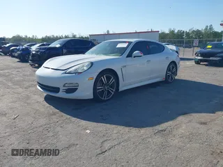 2013 Porsche Panamera with VIN WP0AA2A7XDL014047, listed as a IAAI auction lot 42010031 with 118,681 mi miles and . Bid and sale history available at DreamBid. Image 2.