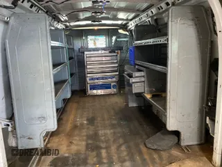 2015 Chevrolet Express Cargo with VIN 1GCWGFCG0F1145334, listed as a IAAI auction lot 42610461 with 143,162 mi miles and . Bid and sale history available at DreamBid. Image 23.