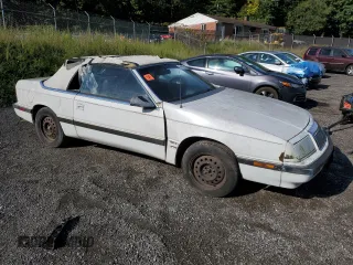 1992 Chrysler LeBaron z VIN 1C3XU553XNF239048, wystawiony jako Copart lot #69465714 z przebiegiem Nie podano mil oraz Tytuł czysty. Historia ofert i sprzedaży dostępna na DreamBid. Obrazek 4.