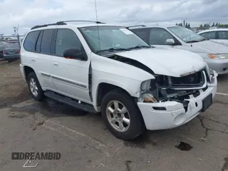2003 GMC Envoy SLE with VIN 1GKDS13S732101189, listed as a IAAI auction lot 41913632 with 245,889 mi miles. Bid and sale history available at carsss.com. Image 1.