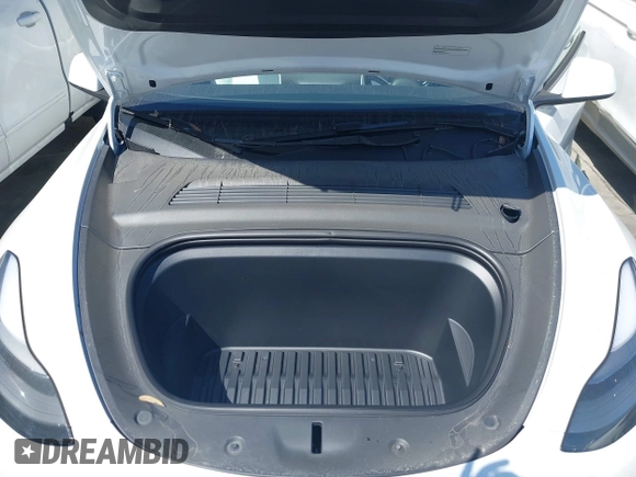 2024 Tesla Model Y with VIN 7SAYGDED2RF017448, listed as a IAAI auction lot 41597056 with 9,702 mi miles and . Bid and sale history available at DreamBid. Image 10.