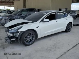 2023 Tesla Model 3 z VIN 5YJ3E1EA0PF665529, wystawiony jako Copart lot #54112665 z przebiegiem 18 407 mil mil oraz Nie do naprawy • Non repairable. Historia ofert i sprzedaży dostępna na DreamBid. Obrazek 1.