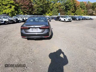 2024 BMW i5 eDrive40 with VIN WBY33FK05RCR58520, listed as a Copart auction lot 77179704 with 16 mi miles and Salvage Title. Bid and sale history available at carsss.com. Image 6.