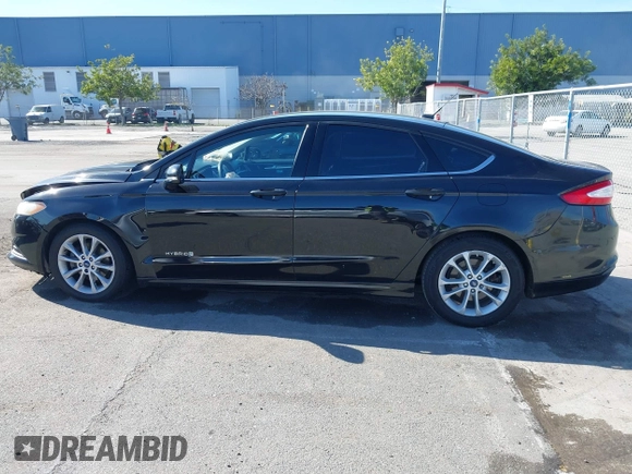 2015 Ford Fusion SE Hybrid with VIN 3FA6P0LU9FR294551, listed as a IAAI auction lot 41545007 with 179,906 mi miles. Bid and sale history available at carsss.com. Image 15.