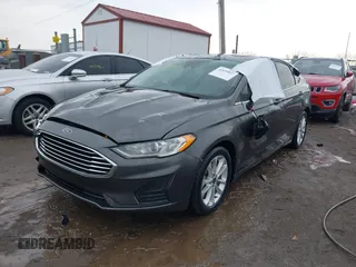 2020 Ford Fusion SE z VIN 3FA6P0LU6LR185721, wystawiony jako IAAI lot #41639827 z przebiegiem 63 857 mil mil oraz . Historia ofert i sprzedaży dostępna na DreamBid. Obrazek 18.