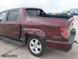 2014 Honda Ridgeline RTL with VIN 5FPYK1F52EB010700, listed as a IAAI auction lot 41490401 with 180,947 mi miles. Bid and sale history available at carsss.com. Image 17.