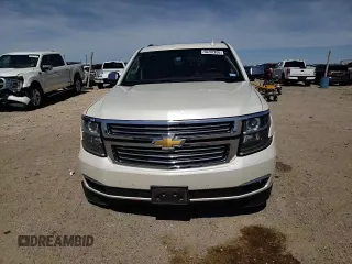 2015 Chevrolet Suburban LTZ with VIN 1GNSKKKC1FR659707, listed as a Copart auction lot 50202895 with 91,680 mi miles and Salvage Title. Bid and sale history available at DreamBid. Image 11.