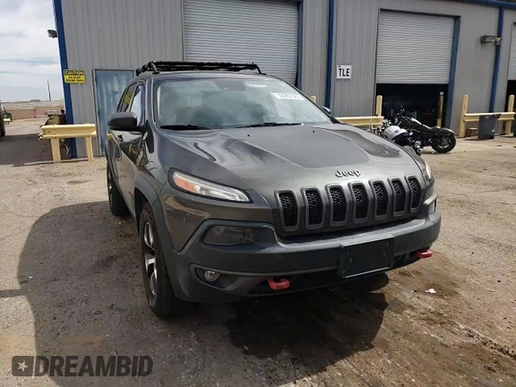 2014 Jeep Cherokee Trailhawk with VIN 1C4PJMBS6EW140981, listed as a Copart auction lot 58260325 with 97,036 mi miles and Salvage title. Bid and sale history available at DreamBid. Image 14.