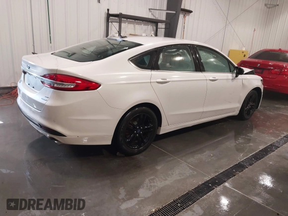 2018 Ford Fusion SE z VIN 3FA6P0HD9JR231970, wystawiony jako IAAI lot #41549490 z przebiegiem 99 803 mil mil oraz . Historia ofert i sprzedaży dostępna na DreamBid. Obrazek 4.