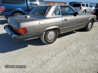 1987 Mercedes-Benz 560 with VIN WDBBA48D7HA063380, listed as a Copart auction lot 77820004 with 81,187 mi miles and Salvage Title. Bid and sale history available at carsss.com. Image 3.