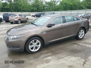 2015 Ford Taurus SEL with VIN 1FAHP2E84FG102075, listed as a Copart auction lot 59740265 with 90,669 mi miles and Salvage title. Bid and sale history available at DreamBid. Image 1.