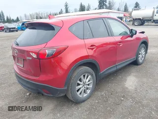 2016 Mazda CX-5 Touring with VIN JM3KE4CY2G0894930, listed as a IAAI auction lot 41906809 with 123,125 mi miles. Bid and sale history available at carsss.com. Image 4.