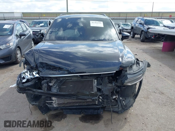 2023 Volkswagen Tiguan SE R-Line Black with VIN 3VVCB7AX1PM106543, listed as a IAAI auction lot 41784559 with 39,846 mi miles and . Bid and sale history available at DreamBid. Image 6.