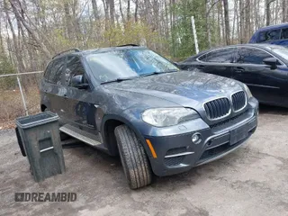 2011 BMW X5 35i with VIN 5UXZV4C56BL406632, listed as a IAAI auction lot 41981590 with 168,534 mi miles. Bid and sale history available at carsss.com. Image 1.