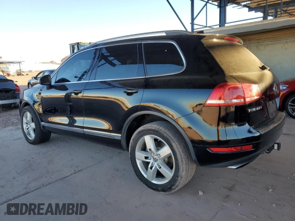 2011 Volkswagen Touareg с VIN WVGFG9BP2BD003056, выставлен на аукционе Copart как лот 84203674 с пробегом 171 456 миль миль и Списание • Salvage title. История ставок и продаж доступна на DreamBid. Изображение 2.