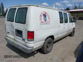 2000 Ford Econoline Cargo with VIN 1FTRE14W7YHA37668, listed as a IAAI auction lot 42001679 with 210,713 mi miles. Bid and sale history available at carsss.com. Image 4.