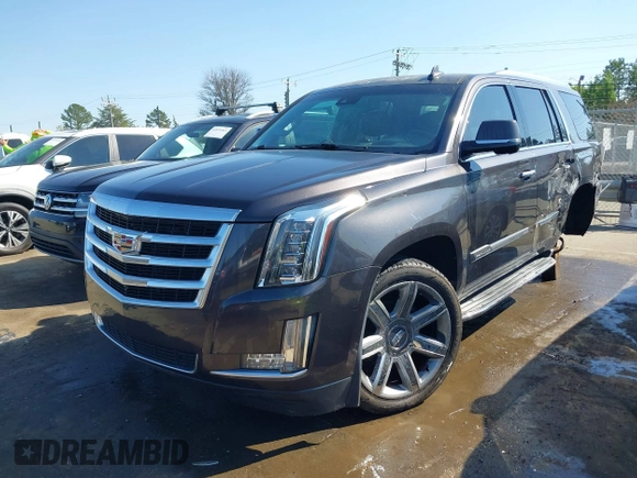 2015 Cadillac Escalade Luxury z VIN 1GYS3MKJ2FR518865, wystawiony jako IAAI lot #41890235 z przebiegiem 156 849 mil mil oraz . Historia ofert i sprzedaży dostępna na DreamBid. Obrazek 18.