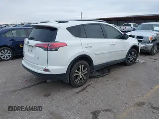 2017 Toyota RAV4 LE with VIN JTMZFREV1HJ103223, listed as a IAAI auction lot 41571466 with 96,860 mi miles and . Bid and sale history available at carsss.com. Image 4.