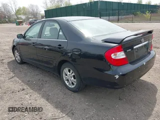 2004 Toyota Camry LE with VIN 4T1BF32KX4U077010, listed as a IAAI auction lot 42039297 with 113,742 mi miles. Bid and sale history available at carsss.com. Image 3.
