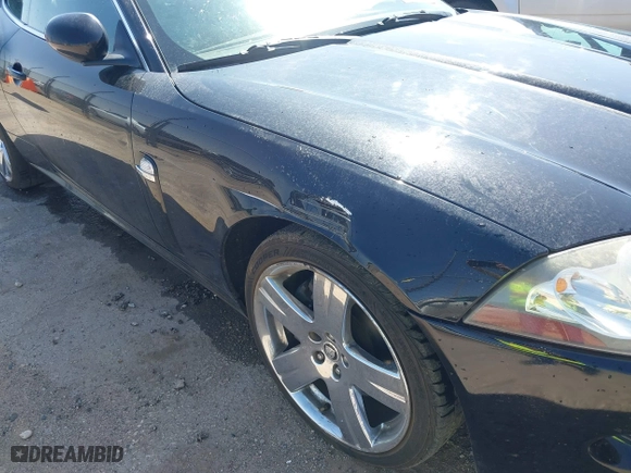 2009 Jaguar XK with VIN SAJWA43B295B31026, listed as a IAAI auction lot 41950751 with 110,331 mi miles. Bid and sale history available at carsss.com. Image 6.