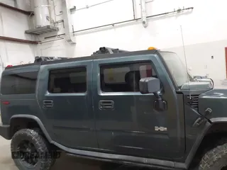 2005 Hummer H2 SUV with VIN 5GRGN23U65H132505, listed as a IAAI auction lot 41515346 with 140,944 mi miles. Bid and sale history available at carsss.com. Image 13.