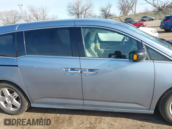 2011 Honda Odyssey Touring with VIN 5FNRL5H9XBB085626, listed as a IAAI auction lot 41890577 with 178,317 mi miles and . Bid and sale history available at DreamBid. Image 13.